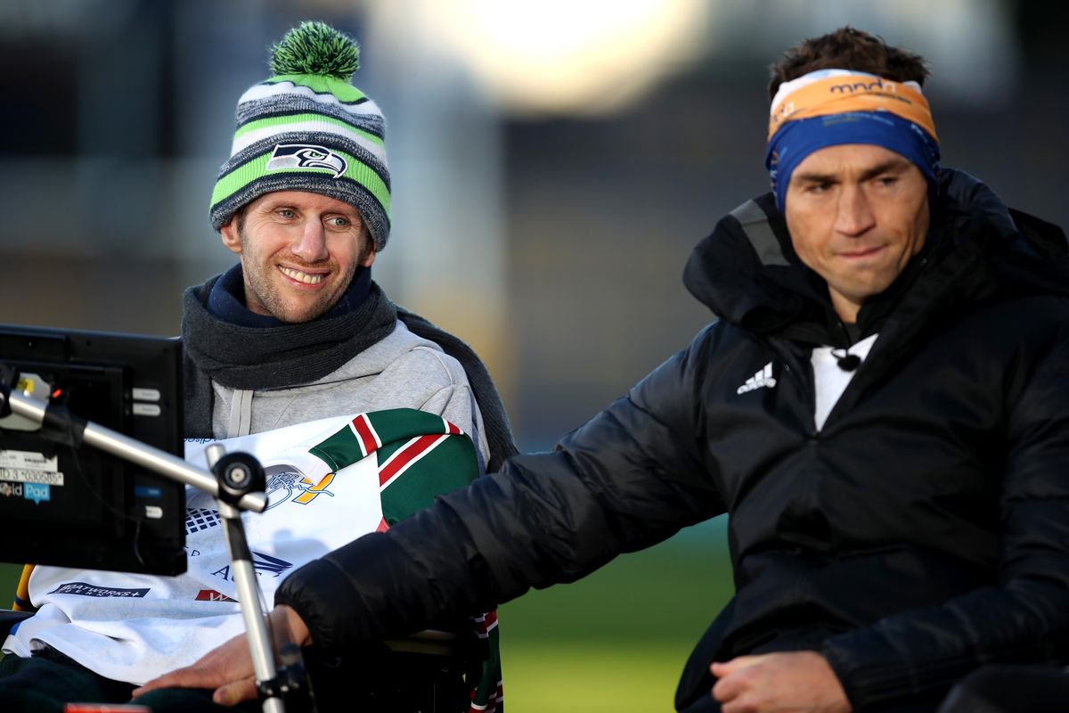 Ex-Leeds Rhinos rugby league player Kevin Sinfield (R) embraces former teammate Rob Burrow after completing his Extra Mile Challenge at Emerald Headingley Stadium on November 23, 2021 in Leeds, England. Sinfield aims to run 101 miles in 24 hours in aid of motor neurone disease research.