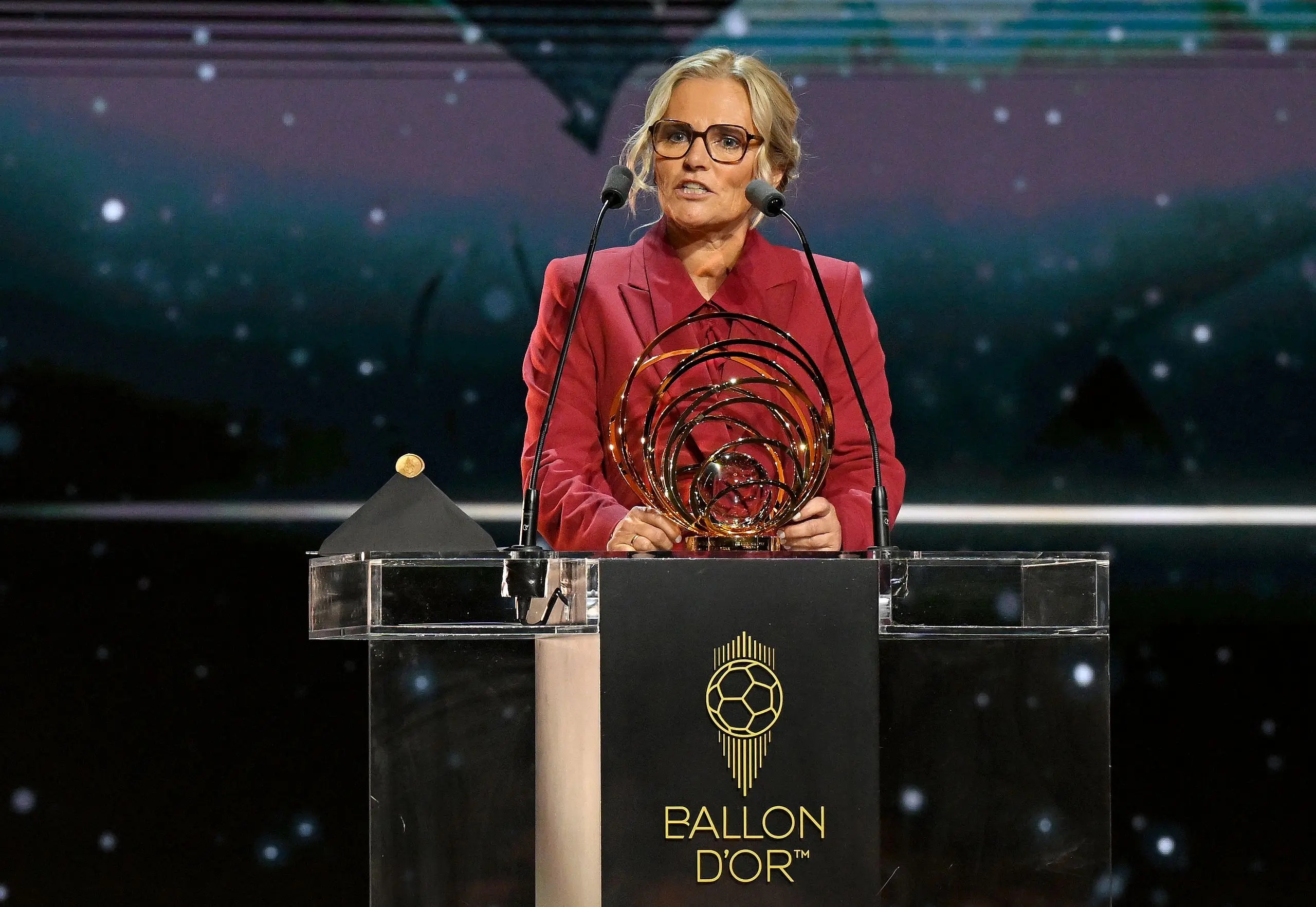 Sarina Wiegman speaks on stage with the Women's Johan Cruyff Trophy during the 69th Ballon D'Or Ceremony