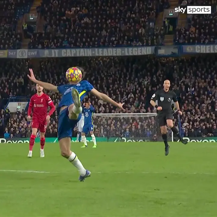 The Chelsea defender tries to bring it down on his toes