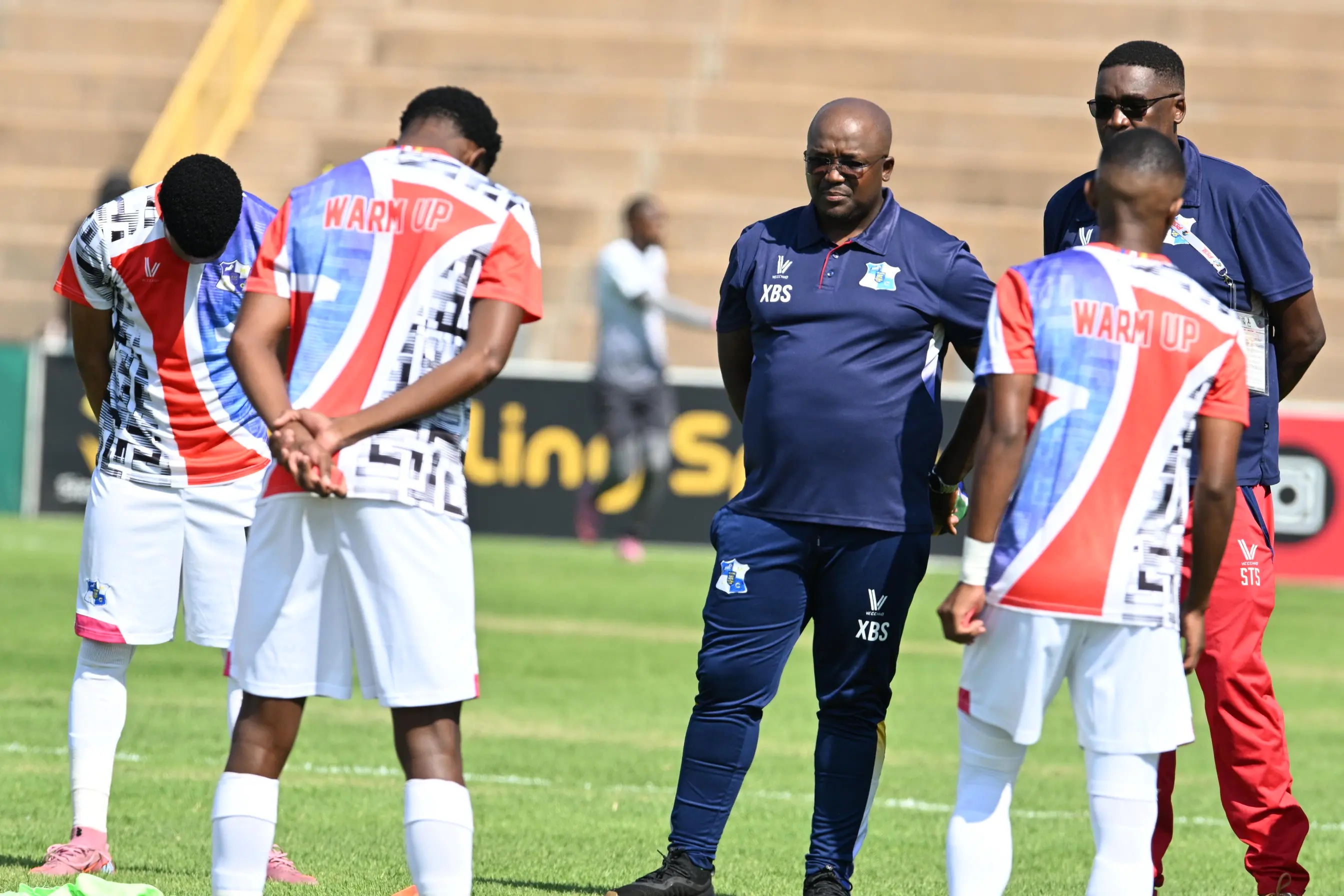 Milford head coach Xanti Pupuma speaks with some of his players at a training session. Picture: LEFTY SHIVAMBU/GALLO IMAGES