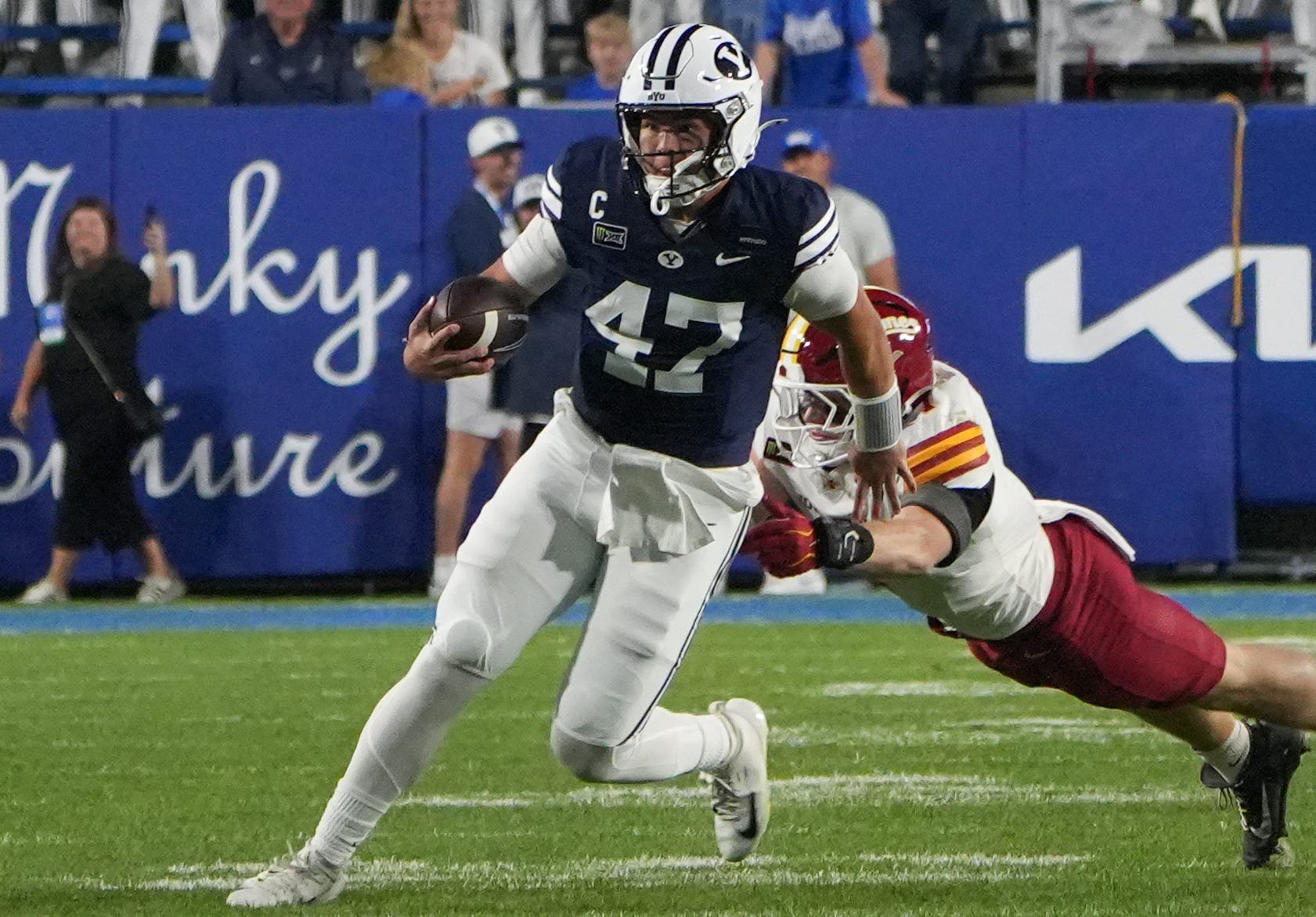 Brigham Young quarterback Bear Bachmeier (47) runs the ball during the second half against Iowa State at LaVell Edwards Stadium.