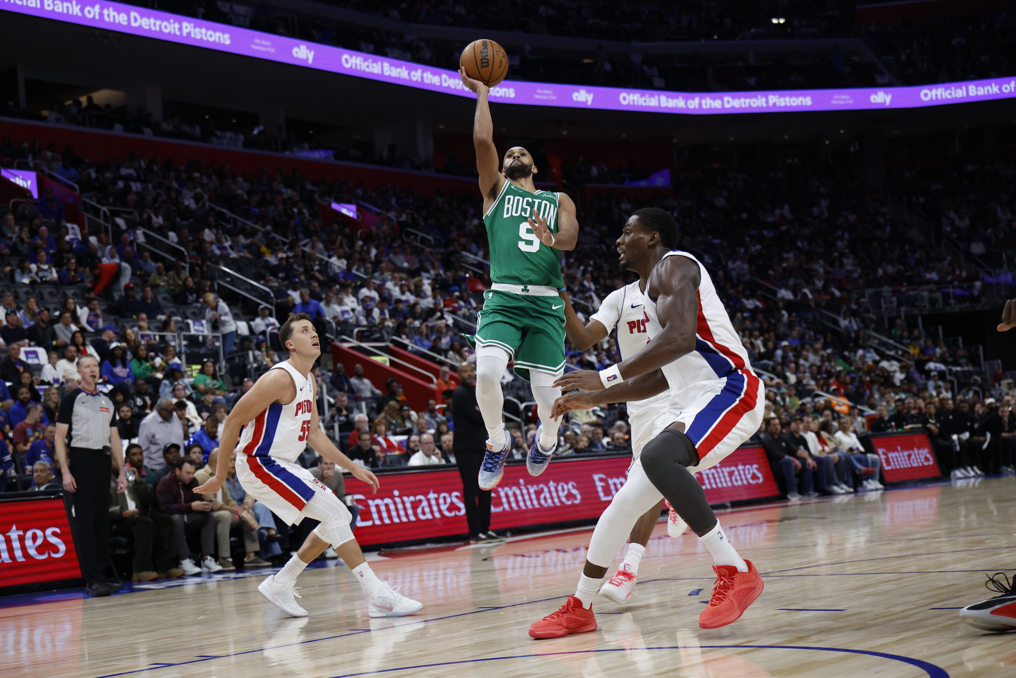 Oct 20, 2026; Detroit, Michigan, USA;  Boston Celtics guard Derrick White (9) shoots on Detroit Pistons center Jalen Duren (0) in the second half at Little Caesars Arena.  Mandatory Credit: Rick Osentoski-Imagn Images
