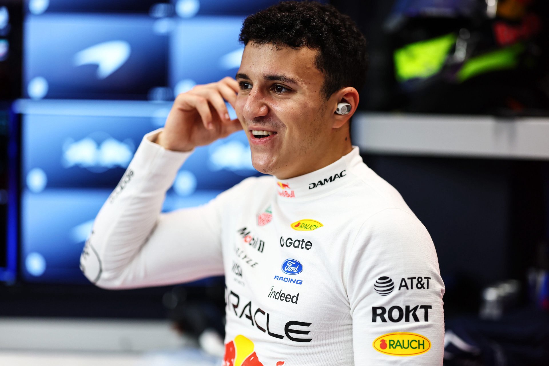 Isack Hadjar of France and Oracle Red Bull Racing prepares to drive in the garage prior to qualifying ahead of the F1 Grand Prix of Singapore.