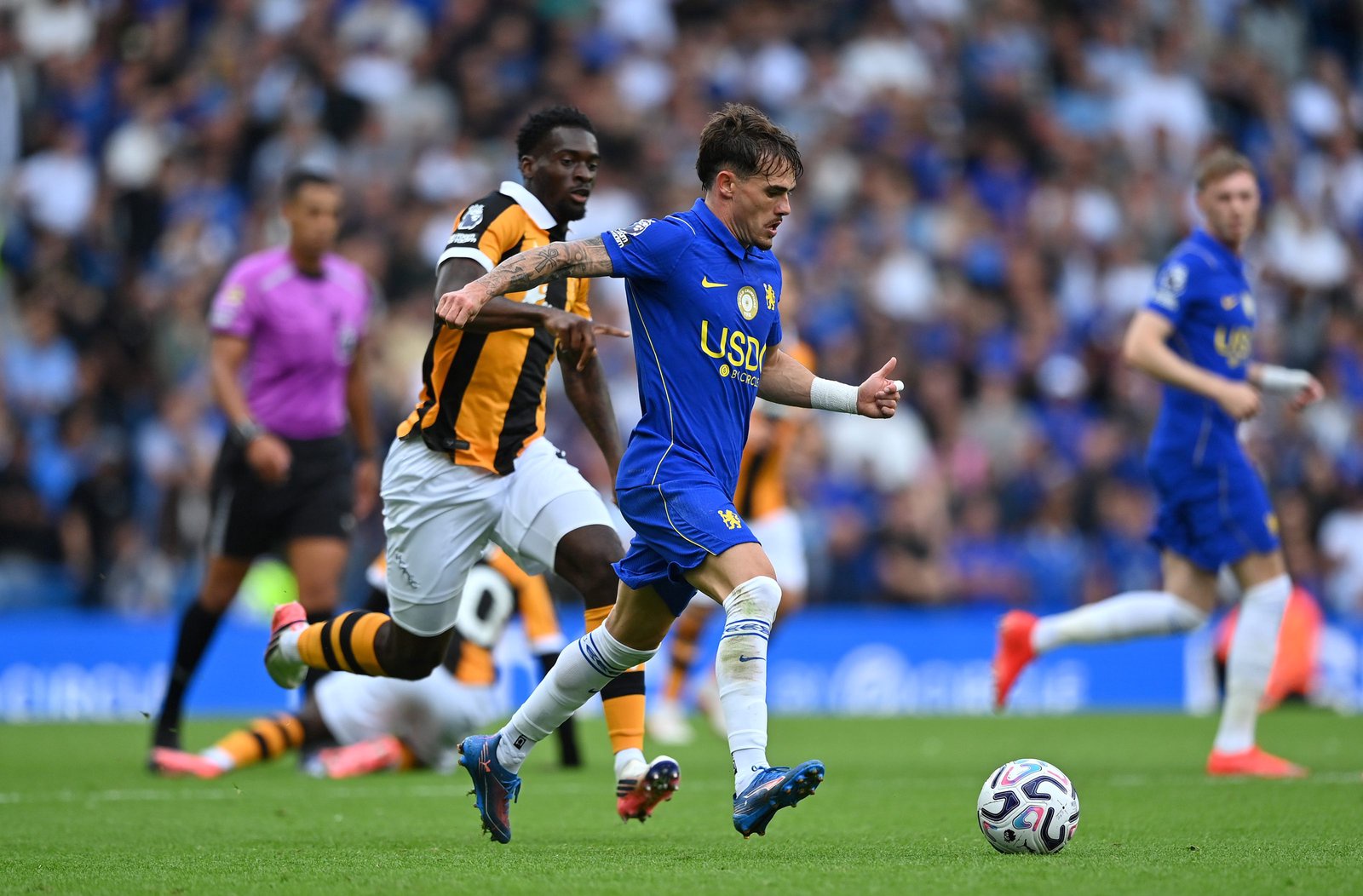 Pep Chavarria of Chelsea runs with the ball under pressure