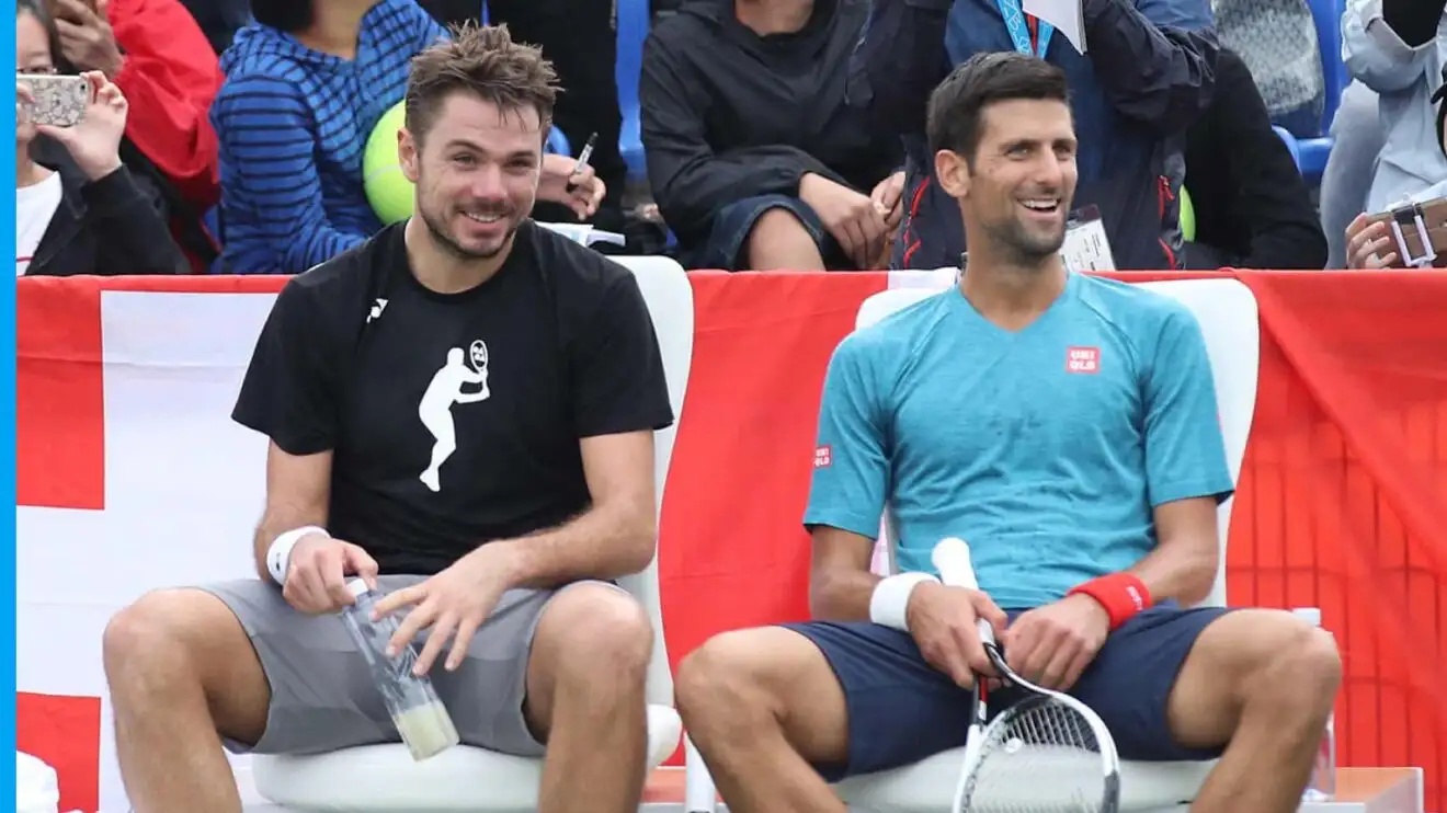 Pictured: Stan Wawrinka sits with Novak Djokovic