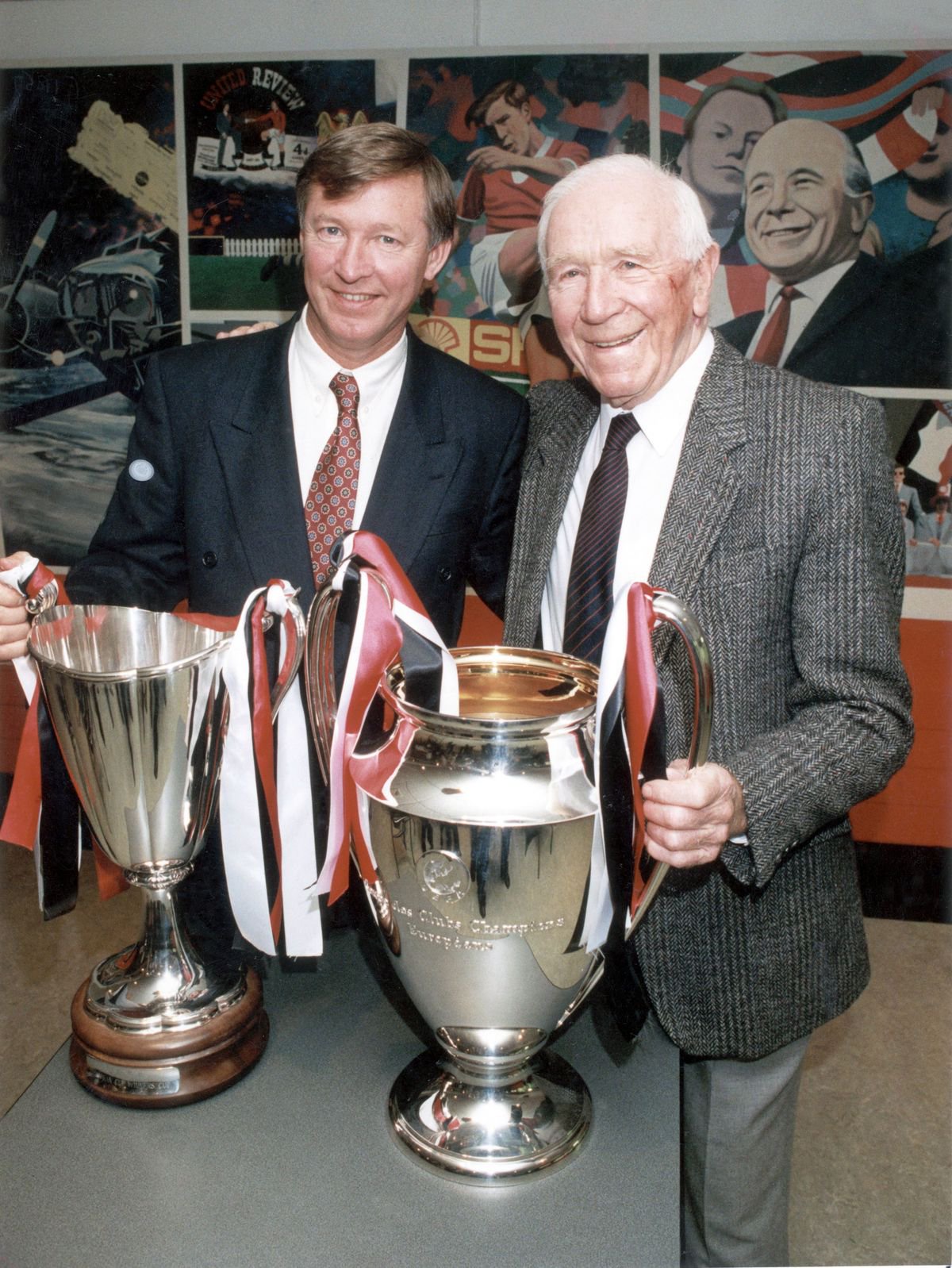 Manchester United were built by two men: Alex Ferguson and Matt Busby posing here with the European trophies they won.