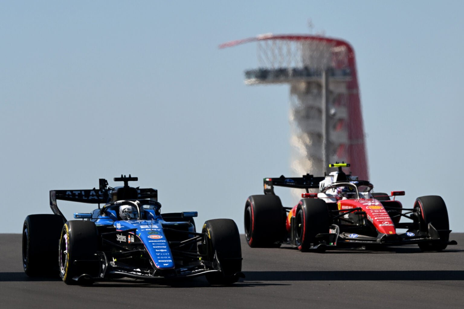 Williams driver Alex Albon leads Ferrari's Lewis Hamilton on track during practice at the 2026 F1 United States Grand Prix