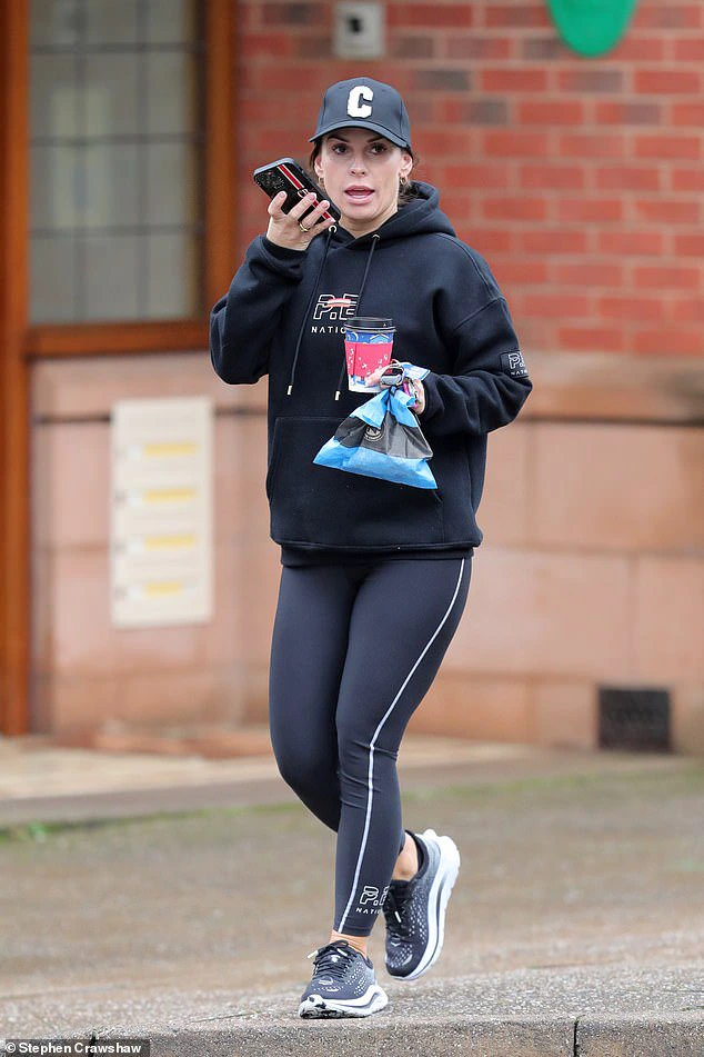 Out and about: Coleen Rooney showed off her toned figure in a pair of skintight leggings on Saturday as she enjoyed a coffee run in Cheshire ahead of New Year's Eve