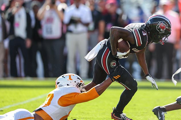 South Carolina wide receiver Mazeo Bennett Jr. (3) breaks free from Tennessee defensive back Dejuan Lane, left, during the first half of an NCAA college football game Saturday, Oct. 24, 2026, in Columbia, S.C. (AP Photo/Artie Walker Jr.)