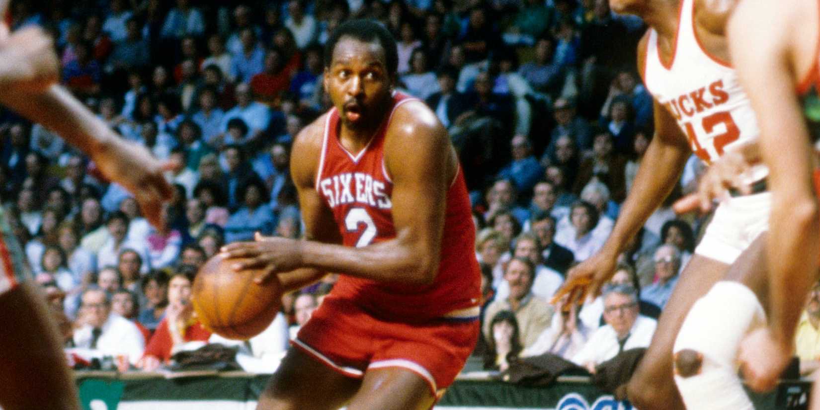 Moses Malone of the Philadelphia 76ers drives to the basket 