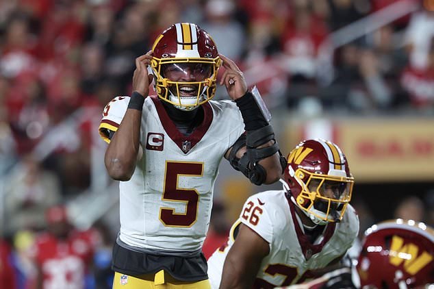 Washington Commanders quarterback Jayden Daniels (5) signals at the line of scrimmage during the second half of an NFL football game against the San Francisco 49ers in Santa Clara, Calif., Monday, Oct. 19, 2026. (AP Photo/Jed Jacobsohn)