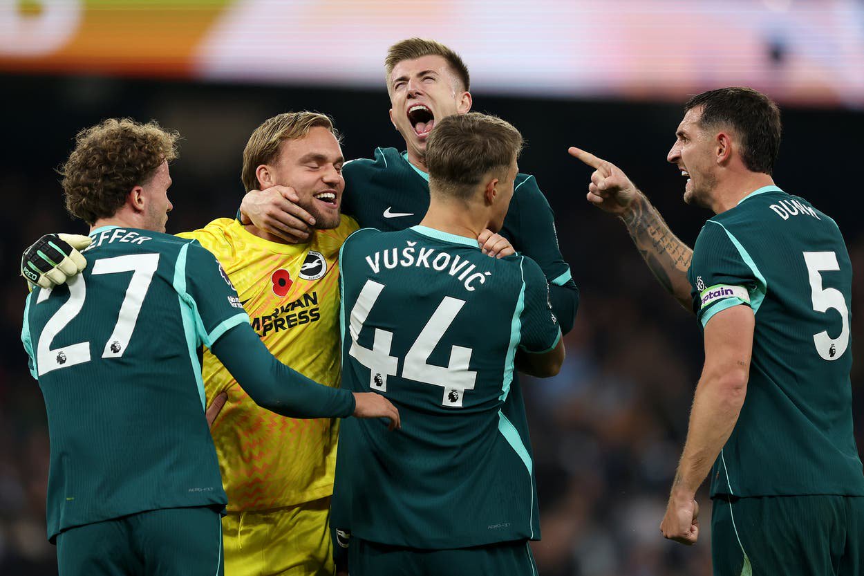 Brighton players celebrate with goalkeeper Bart Verbruggen after shutting out Man City at the Etihad