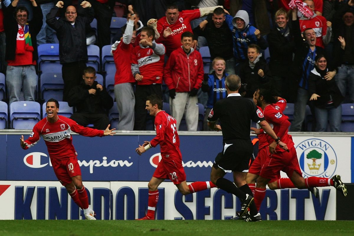 Jeremie Aliadiere celebrates at Wigan