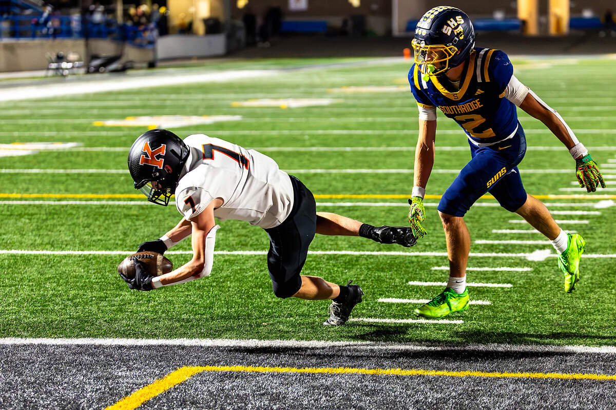 Kennewick's Leroy Ables (7) makes a touchdown catch near the sideline as Southridge's Tayton Jackman (2) closes in during the Lions' game against the Suns on Thursday at Neil F. Lampson Stadium in Kennewick.