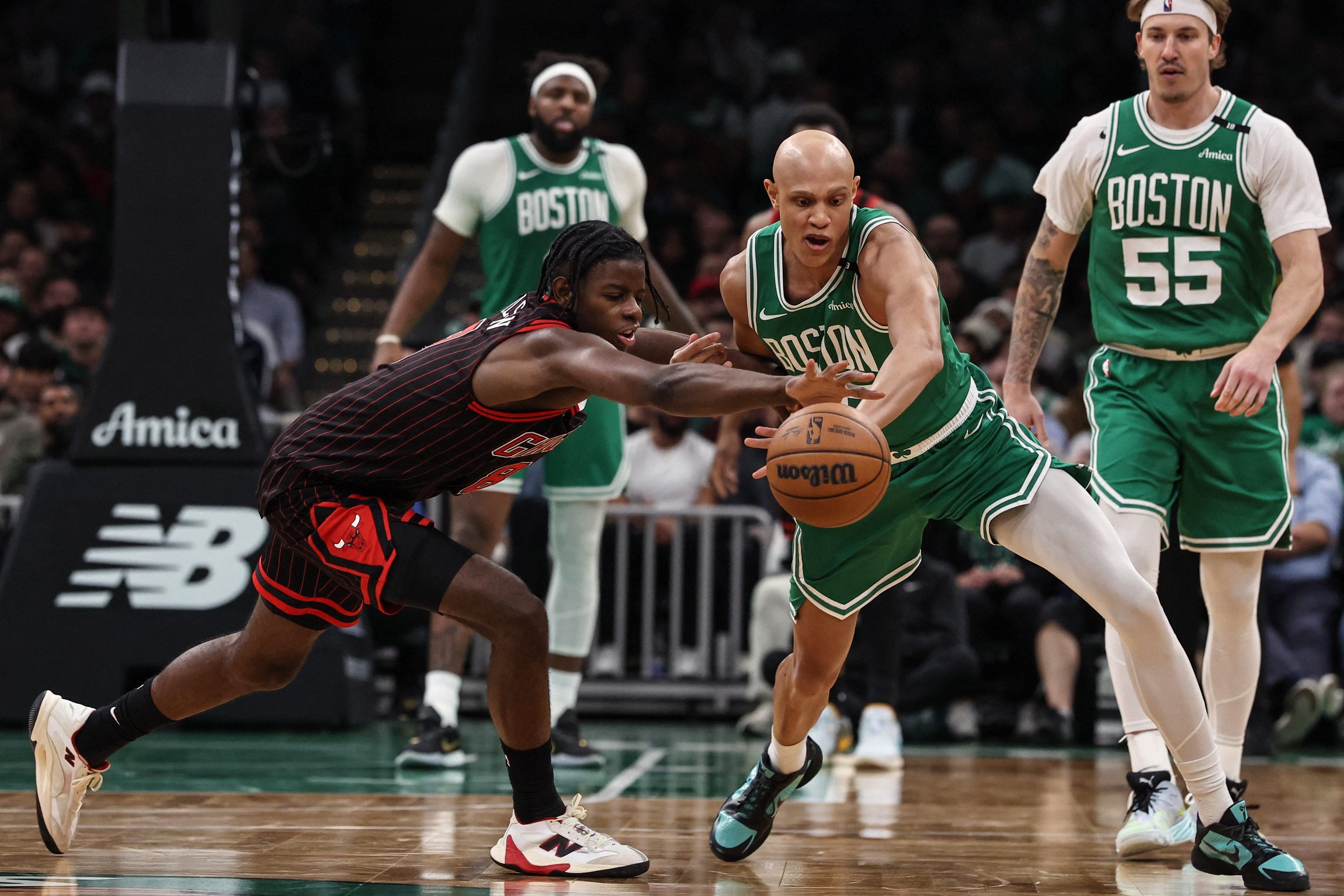 Oct 26, 2026; Boston, Massachusetts, USA; Chicago Bulls forward Caleb Wilson (8) and Boston Celtics guard Jordan Walsh (27) battle for a loose ball during the second half at TD Garden. Mandatory Credit: Winslow Townson-Imagn Images