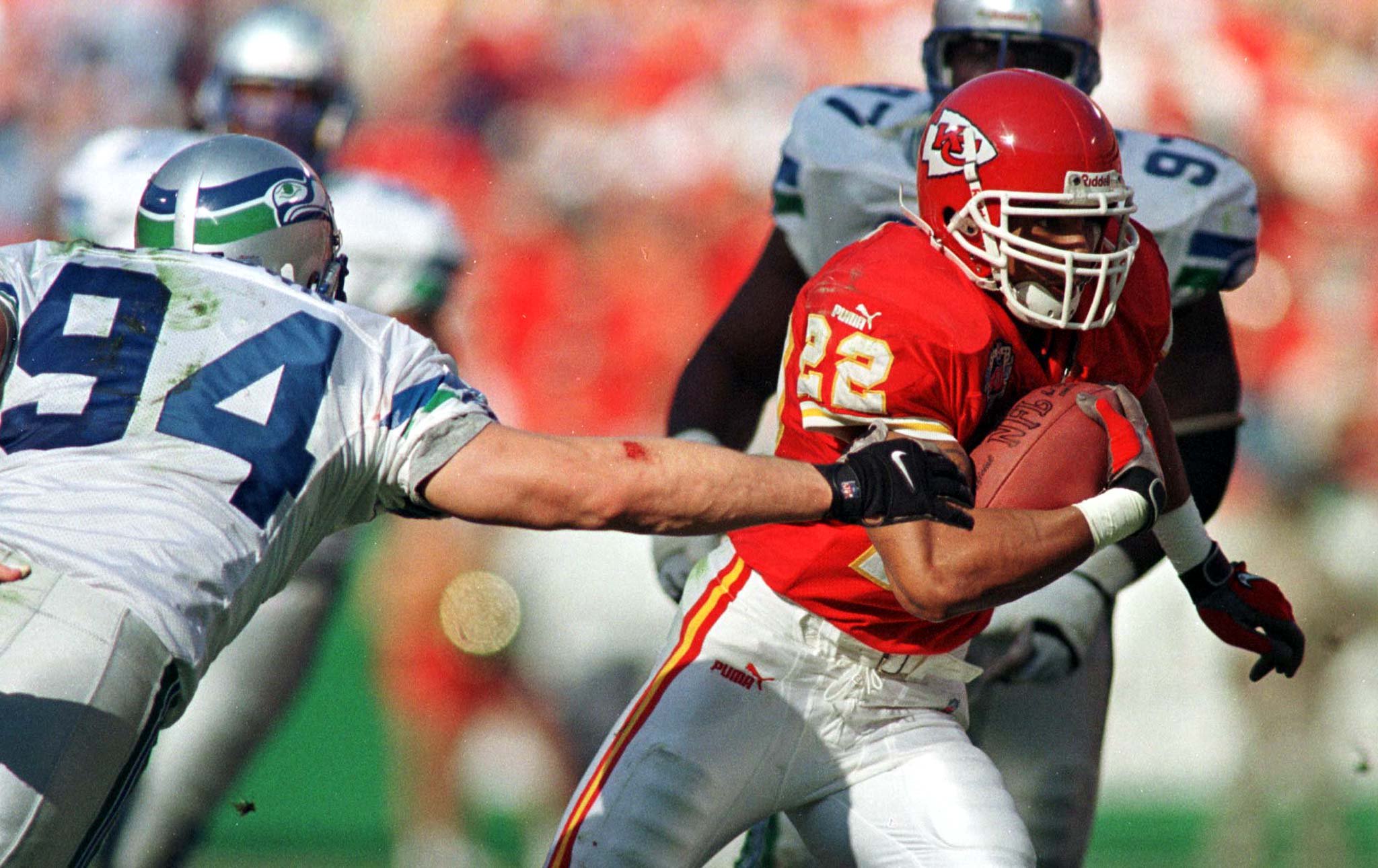 Kansas City Chiefs running back Rashaan Shehee (22) eludes the tackle of Seattle Seahawks Chad Brown (94) during first half action in Kansas City November 21.

JAT