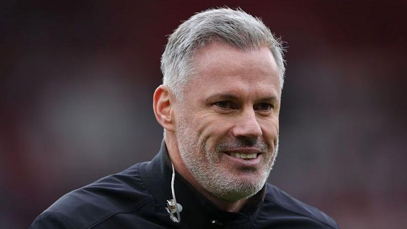 Jamie Carragher smiles during commentary