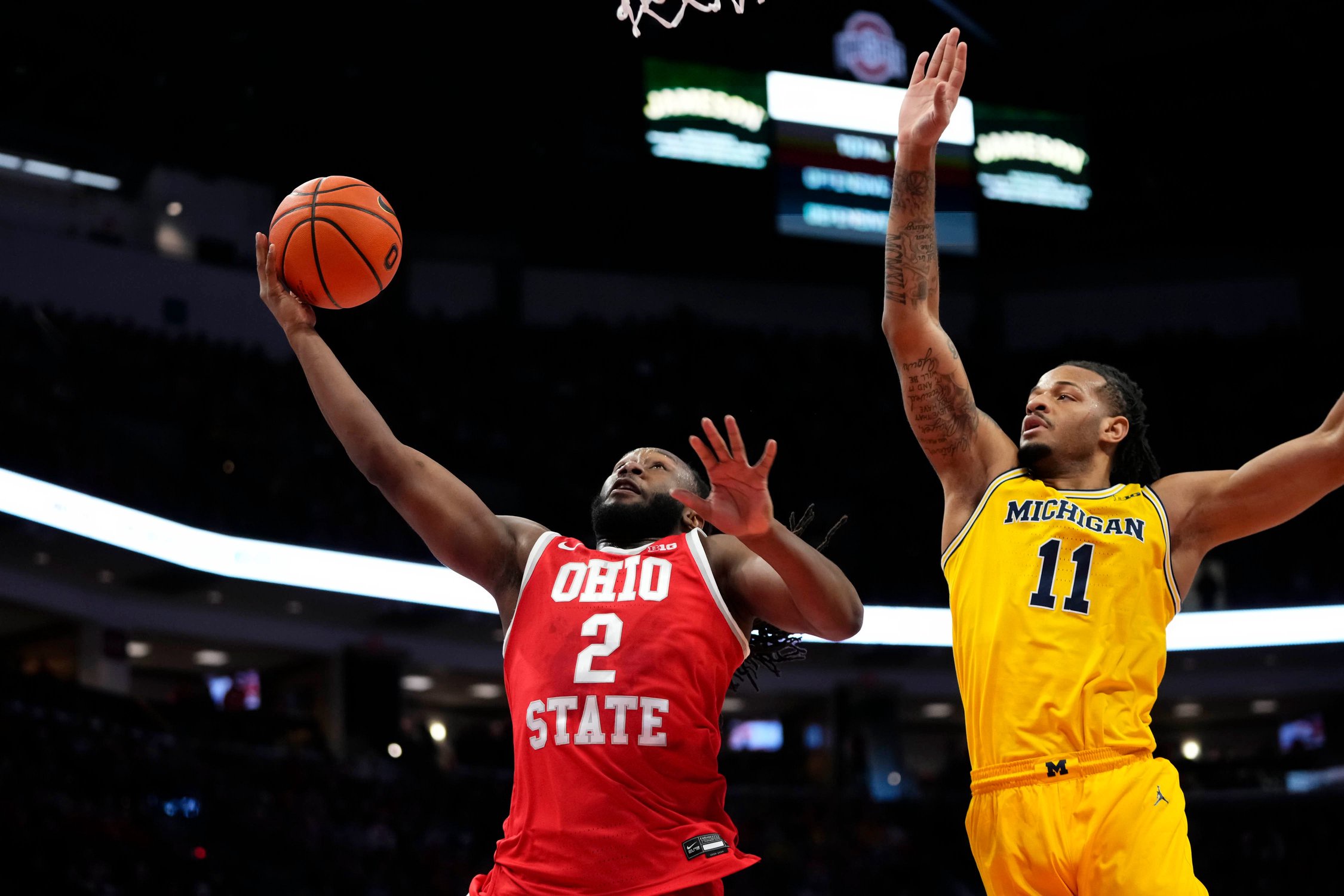 Ohio State Buckeyes guard Bruce Thornton (2) shoots around Michigan Wolverines guard Roddy Gayle Jr. (11) during the NCAA men's basketball game at the Schottenstein Center in Columbus on Feb. 8, 2026.