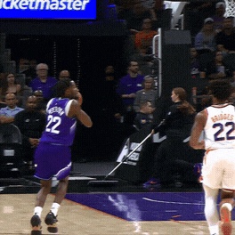 Darryn Peterson tosses the alley-oop to Ace Bailey as he swoops in from the wing.