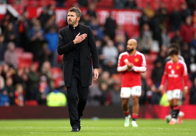 Michael Carrick acknowledges the fans after defeat. Photograph: Dan Istitene/Getty Images