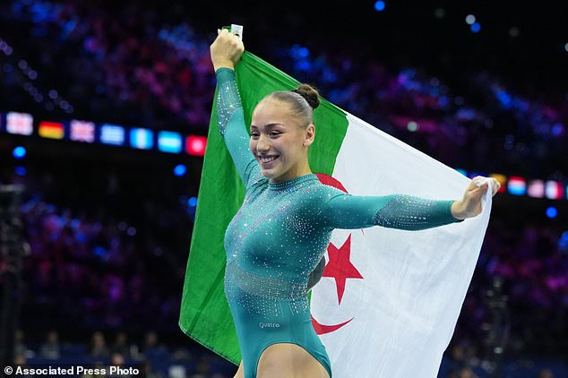 Kaylia Nemour, of Algeria, poses after winning the gold medal in the beam during the apparatus finals at the Artistic Gymnastics World Championships in Rotterdam, the Netherlands, Sunday, Oct. 25, 2026. (AP Photo/Patrick Post)