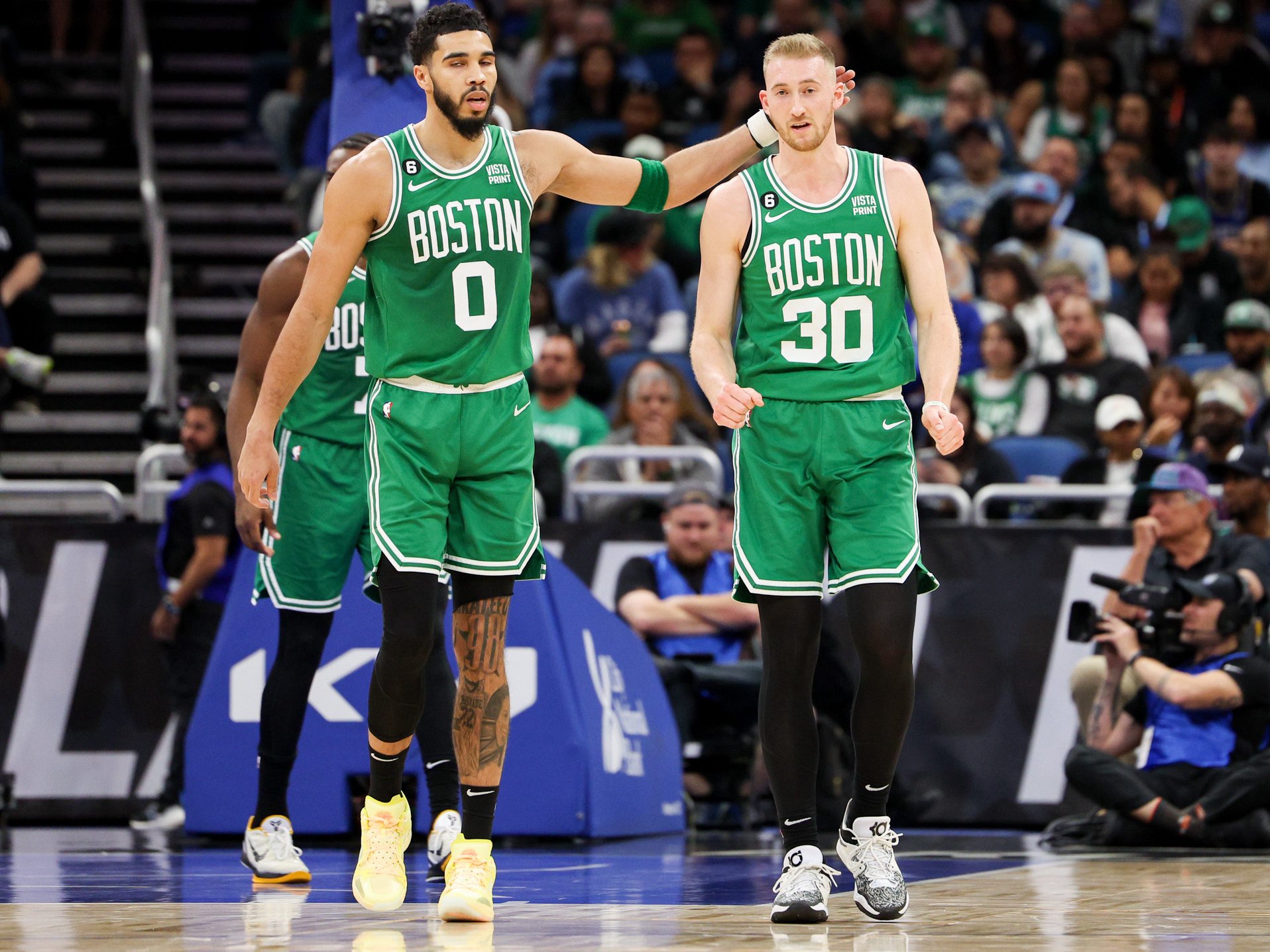 Jan 23, 2023; Orlando, Florida, USA; Boston Celtics forward Jayson Tatum (0) and forward Sam Hauser (30) react after a play against the Orlando Magic in the second quarter at Amway Center. Mandatory Credit: Nathan Ray Seebeck-USA TODAY Sports