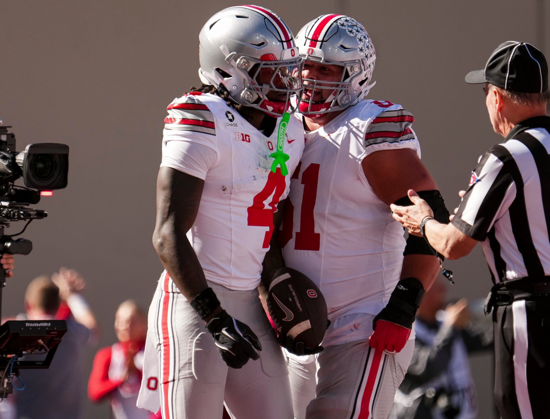 Ohio State wide receiver Jeremiah Smith (4) celebrates a touchdown with offensive lineman Luke Montgomery (51) during their game against Indiana at Memorial Stadium.