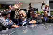 Pezeshkian waves to supporters on the day of the presidential election