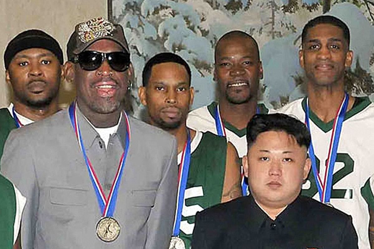 North Korean leader Kim Jong-Un (front R) photographed with former US basketball star Dennis Rodman (front L) and other former NBA players at Pyongyang Gymnasium in Pyongyang
