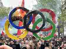 People also set makeshift Olympic rings on fire to show their outrage over the summer games