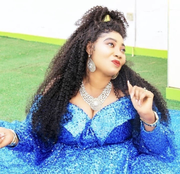 Check out the pictures of Prophet Opambour's lovely wife.