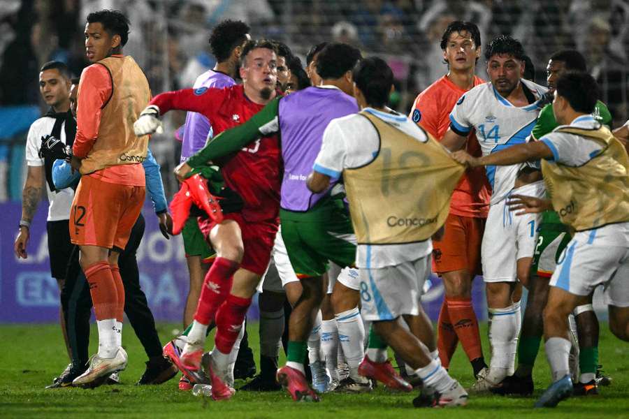 Etienne Vaessen (in red) during a fight between Suriname and Guatemala