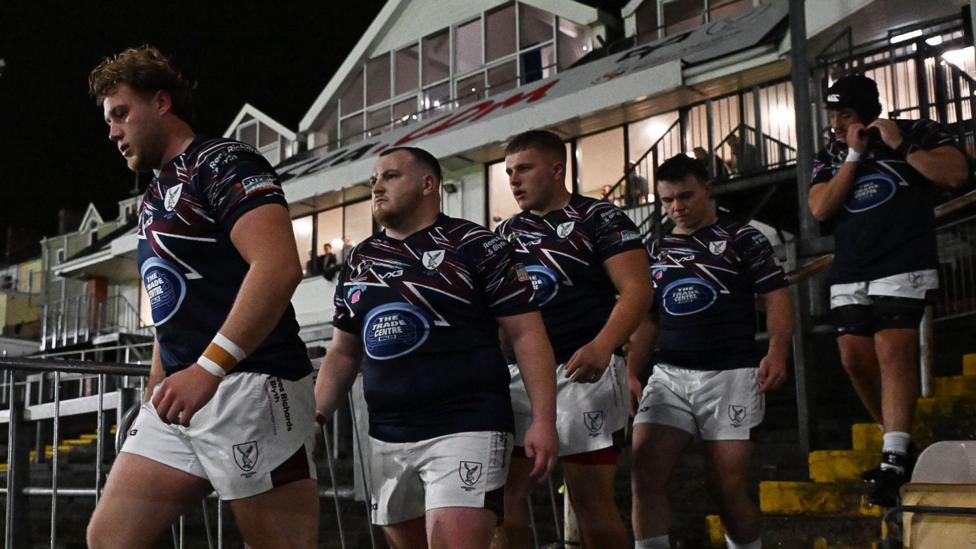 Swansea players take to the field at the revamped St Helen's