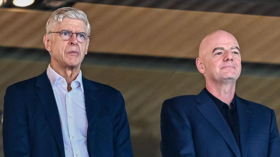 Arsene Wenger and Gianni Infantino stood alongside one another