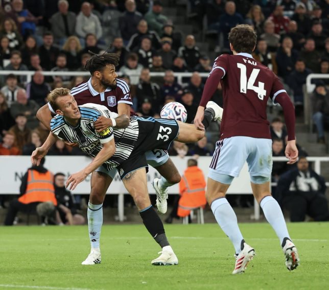 NEWCASTLE UPON TYNE, ENGLAND - OCTOBER 17: Newcastle United's Dan Burn battles for possession with Aston Villa's Tyrone Mings during the Premier League 2026/27 match between Newcastle United and Aston Villa FC at St James' Park on October 17, 2026 in Newcastle upon Tyne, United Kingdom. (Photo by Lee Parker - CameraSport via Getty Images)