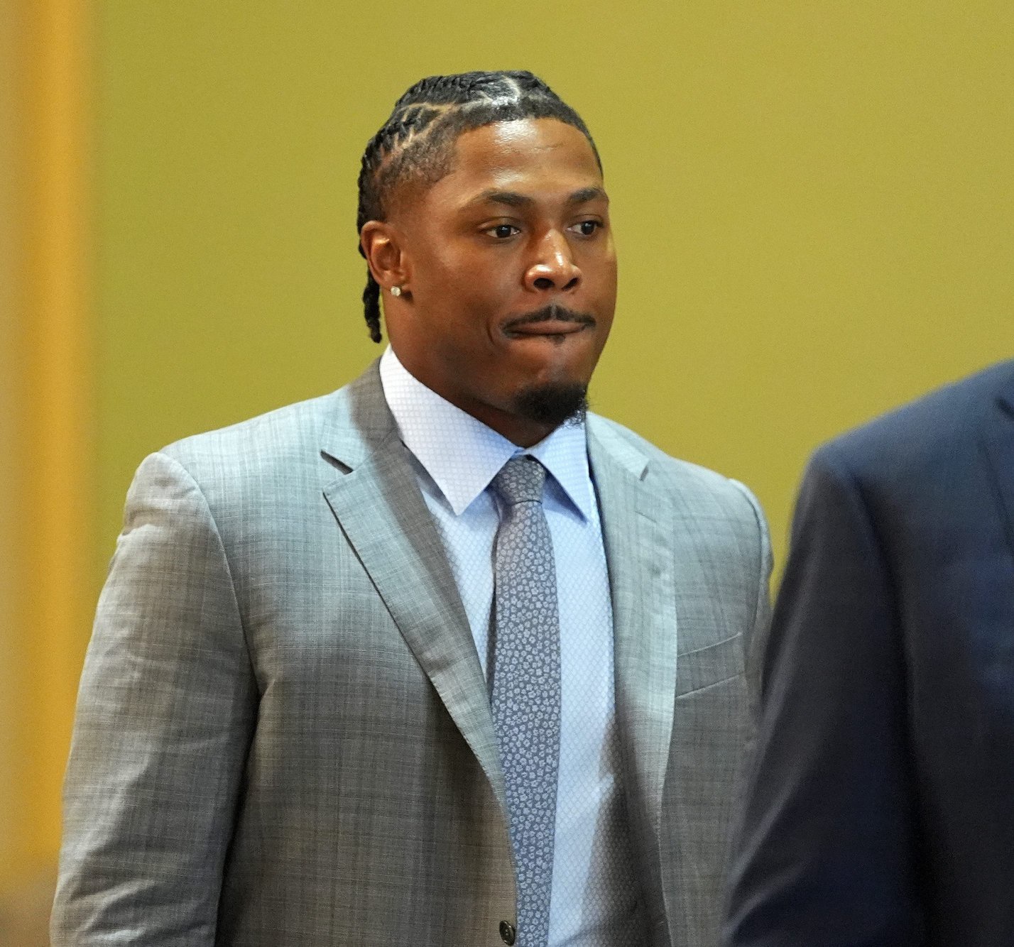 Green Bay Packers running back Josh Jacobs, right, appears in a Brown County courtroom on Sept. 10, 2026 in Green Bay, Wis., with his attorney Clarence Duchac III.