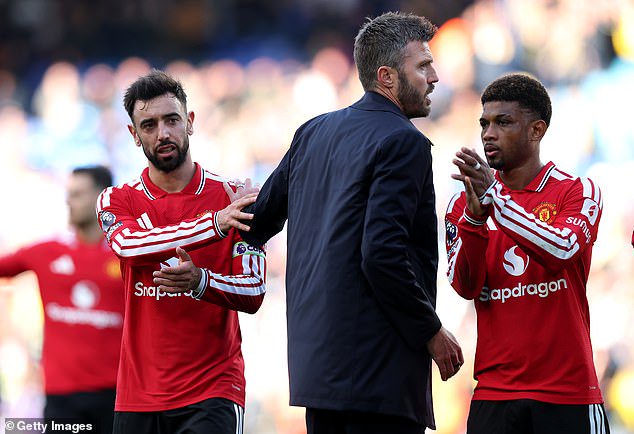 Bruno Fernandes, Carrick and Amad Diallo salute United's fans at the final whistle
