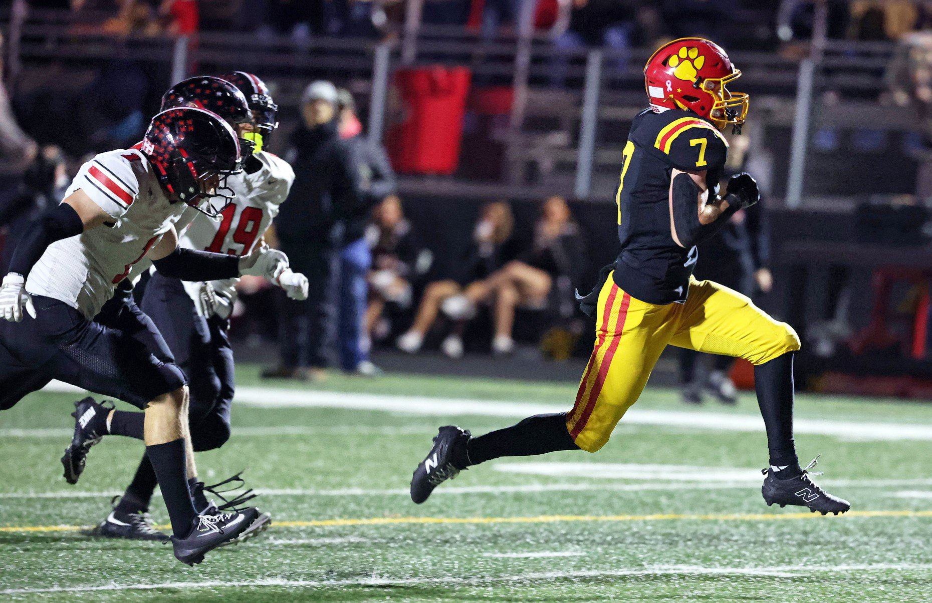 Batavia's Charlie Rosengren (7)out runs Lincoln Way Central defenders Thomas...