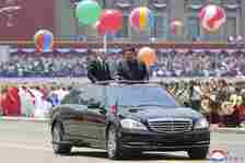 The Russian leader was greeted by colourful balloons, flowers and flags