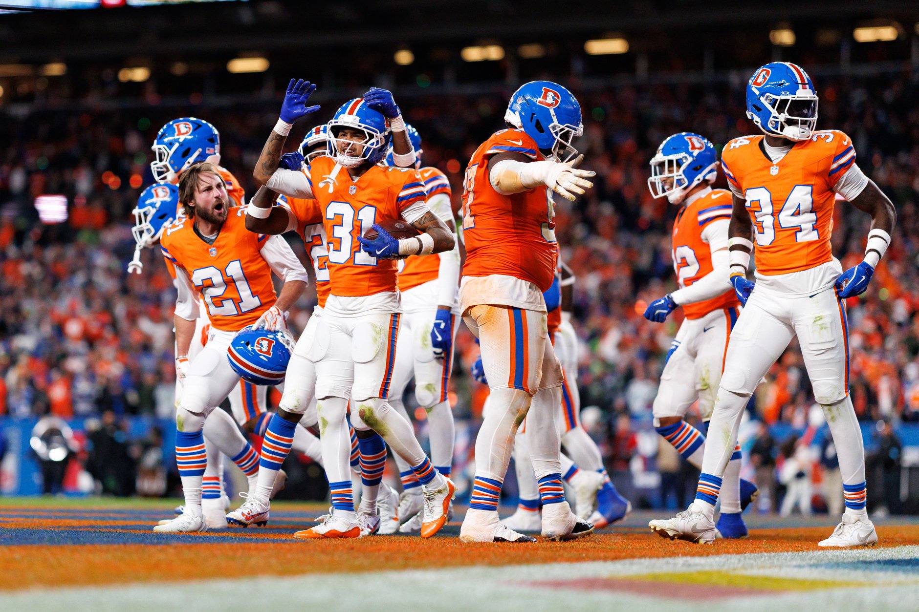 Kris Abrams-Draine 31 of the Denver Broncos celebrates with his teammates after securing an interception during the fourth quarter of an NFL football game against the Seattle Seahawks at Empower Field at Mile High on October 15, 2026 in Denver, Colorado.