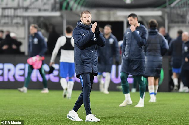 Brighton´s head coach Fabian Hurzeler applauds the travelling fans (Vit Tcherny/AP)