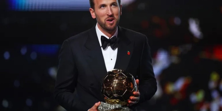 Bayern Munich's Harry Kane celebrates after winning the men's Ballon d'Or award [Matthew Childs/Action Images via Reuters]