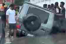 Watch As Good Samaritans Defy Flooded Lekki Road To Save Mercedes G-Class Stuck In A Roadside Drainage - autojosh