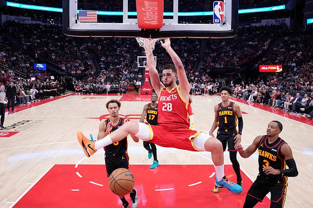 Houston Rockets center Alperen Sengun (28) dunks during the first quarter of an NBA basketball game against the Atlanta Hawks, Monday, Oct. 26, 2026, in Houston. (AP Photo/Kevin M. Cox)