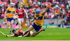 Shane O'Donnell of Clare is tackled by Eoin Downey of Cork. Photo by Ray McManus/Sportsfile