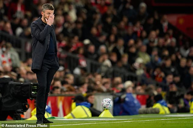Manchester United's head coach Michael Carrick reacts during the English Premier League soccer match between Manchester United and Tottenham Hotspur in Manchester, England, Saturday, Oct. 10, 2026. (AP Photo/Dave Thompson)
