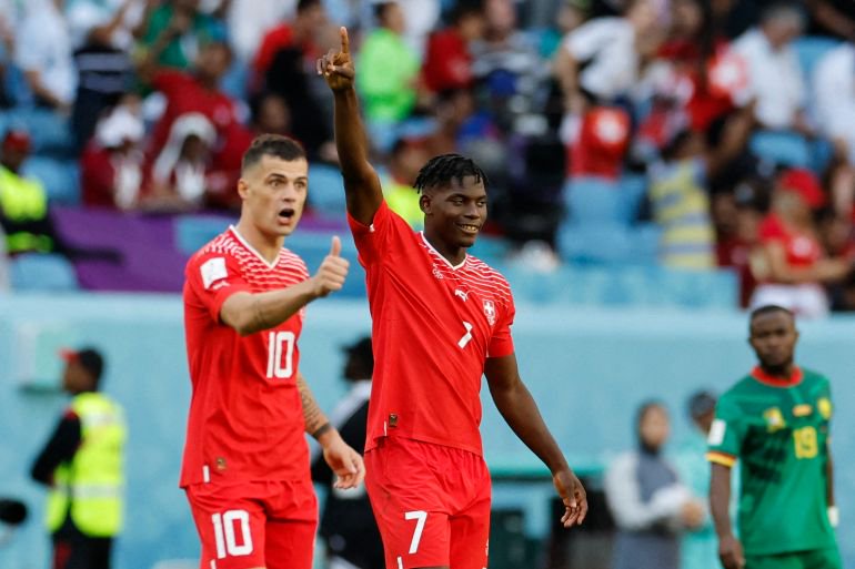 Soccer Football - FIFA World Cup Qatar 2022 - Group G - Switzerland v Cameroon - Al Janoub Stadium, Al Wakrah, Qatar - November 24, 2022 Switzerland's Breel Embolo celebrates scoring their first goal with Granit Xhaka REUTERS/Issei Kato