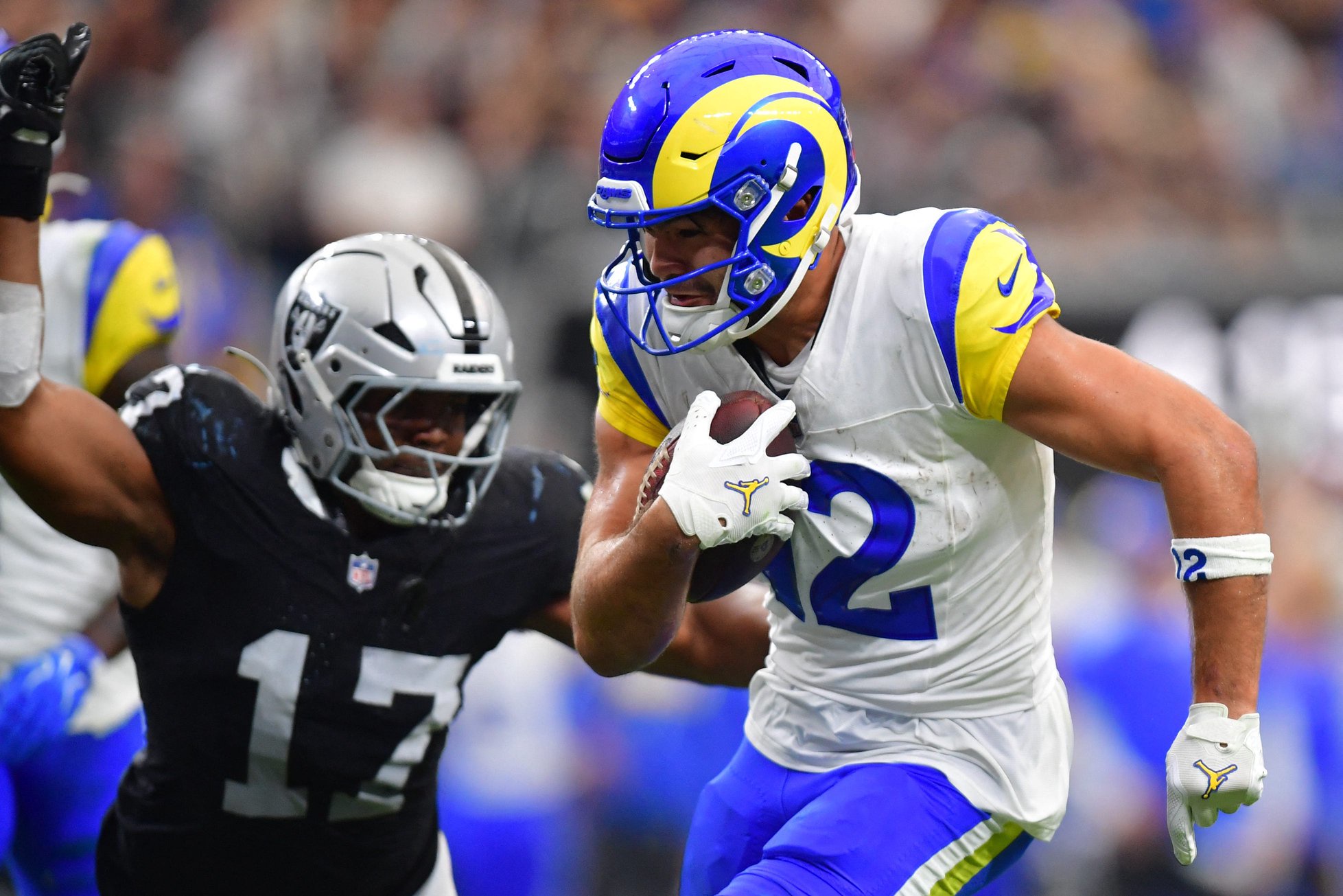 Oct 25, 2026; Paradise, Nevada, USA;  Los Angeles Rams wide receiver Puka Nacua (12) makes a catch over Las Vegas Raiders linebacker Nakobe Dean (17) in the first half at Allegiant Stadium.  Mandatory Credit: Gary A. Vasquez-Imagn Images