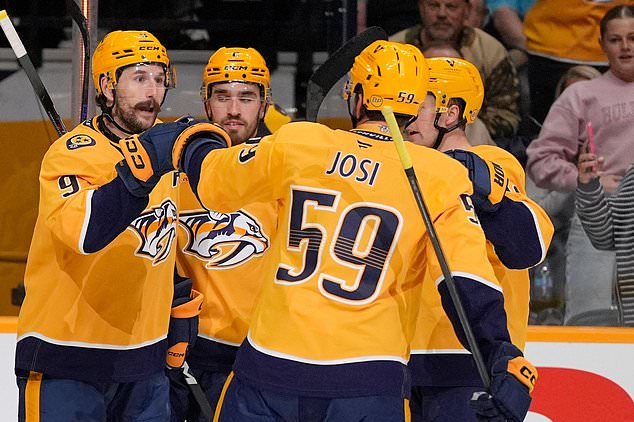 Nashville Predators left wing Filip Forsberg (9) celebrates his goal with teammates defenseman Adam Wilsby (2) and defenseman Roman Josi (59) during the second period of an NHL hockey game Thursday, Oct. 29, 2026, in Nashville, Tenn. (AP Photo/George Walker IV)