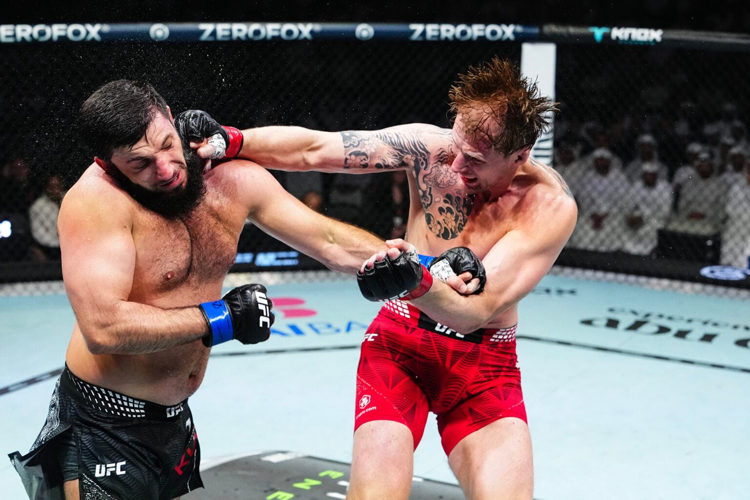 Alexander Volkov punches Rizvan Kuniev during their fight at UFC 333